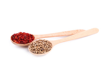 Spices mix on wooden spoons isolated on a white wooden background. Top view