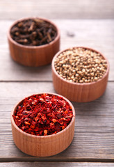 Spices mix on a grey wooden background. Top view