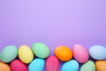 Colorful easter eggs on a purple background