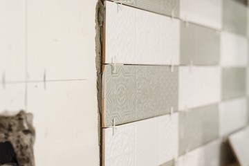 Process of laying ceramic tiles, construction and repair in the kitchen, tiles
