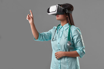Young attractive doctor in a virtual reality glasses