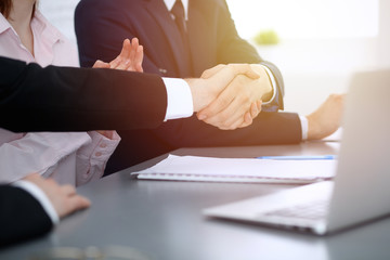 Business people shaking hands finishing up a meeting. Handshake at successful negotiation