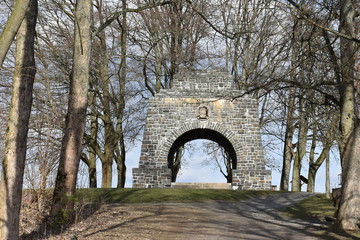 Landscape in Zeulenroda in Thüringen with many trees and a stone gate in Germany