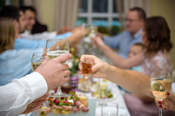 Celebration. People holding glasses of champagne making a toast