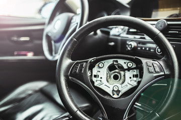 repair of the steering mechanism of the car. Replacing the steering wheel in a sports car. safety bag.
