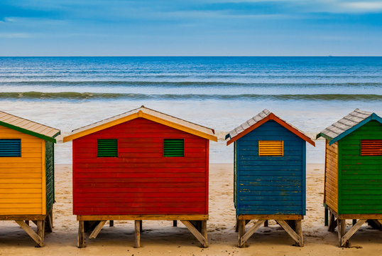 Colorful bathing huts in Muizenberg beach, in front of the ocean sea, Cape Town, South Africa