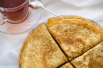 Russia, Severodvinsk, a stack of homemade Russian pancakes in the form of a triangular envelope, flat lay