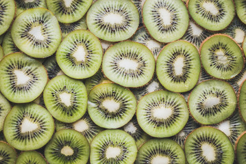 Kiwi slices background. Slices of ripe kiwi. Kiwi background