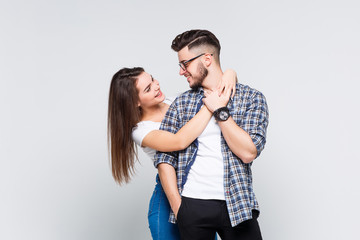 Business couple standing embracing and hugging at white background.