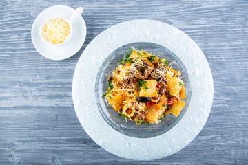 Pappardelle with ragout of a lamb, is served with grated cheese