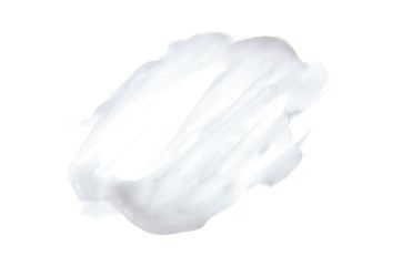 White cosmetic cream texture on white background isolation, top view