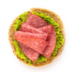 Sandwich with salami sausage on white background.