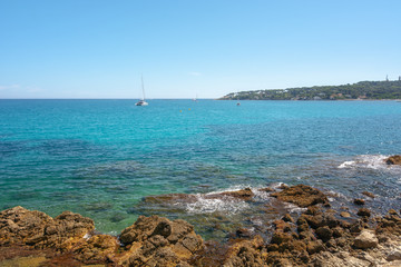 View on the sea off the coast of Antibes, with the Cap d'Antibes peninsula in the background