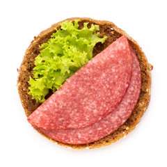 Sandwich with salami sausage on white background.