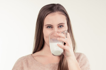 girl drinks milk and is happy