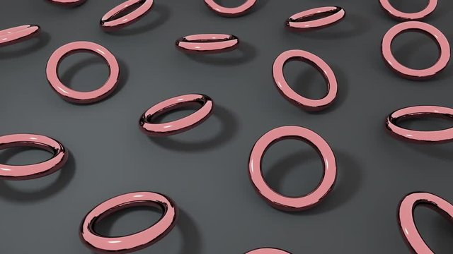 3D rose gold torus rotating on dark surface. Abstract creative 4k seamless loop animation.