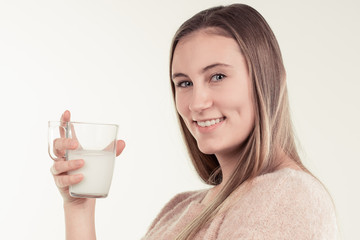 girl drinks milk and is happy