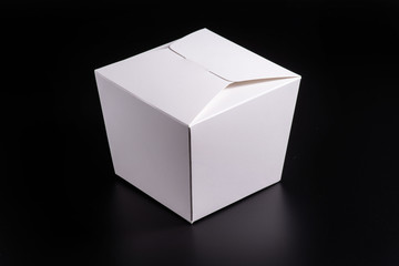 white cardboard box on black background, moke up