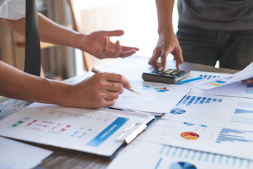 financial planning meeting calculating and analysis budget numbers in office Business people concept.