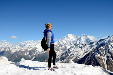 Young woman on vacation in the mountains, Elbrus