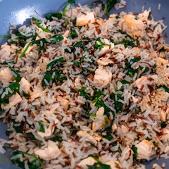 wok with wild rice, salmon and spinach