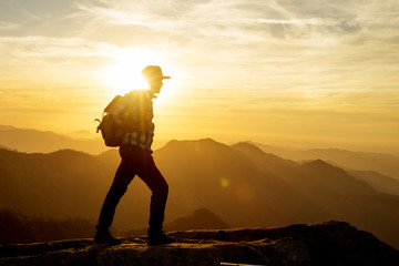 Hiker meets the sunset on the Moro rock in Sequoia national park, California, USA.