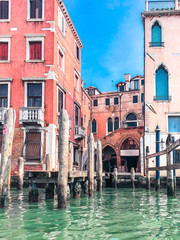Small romantic canal, old buildings and traditional venetian houses