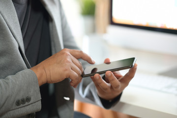 Man's hand using cellphone
