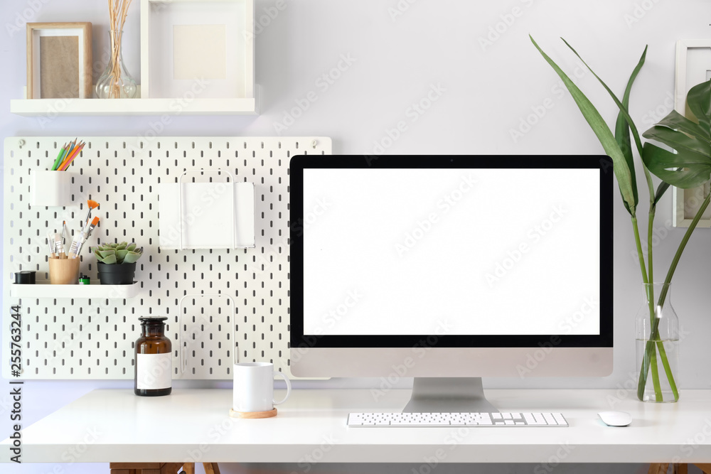 Fototapete Mock up loft workspace with blank screen computer for graphic display montage..