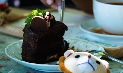 Eating chocolate cake with spoon.