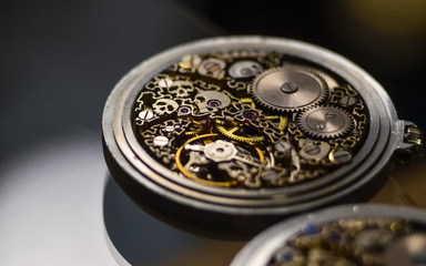 mechanism with gears. clockwork skeleton. Elegant vintage handmade pocket watches with exclusive carvings and engravings. jewelry.