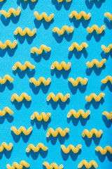 Pasta closeup on a blue background. View from above.
