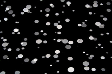 white dots on black background