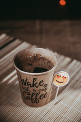 Cup of coffee on table with bookeh background
