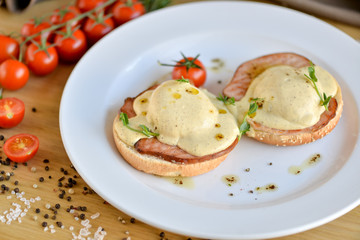 fried eggs with bacon and vegetables