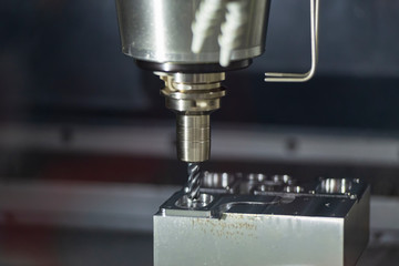 The  CNC milling machine cutting the mould part with the solid radius end mill tool.The...