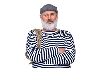 Smiling sailor with a rope on his shoulders with a gray beard, striped shirt