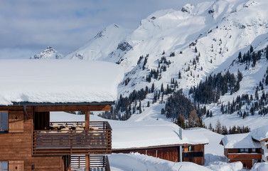winter luxury wooden chalet terrace Austria ski resort