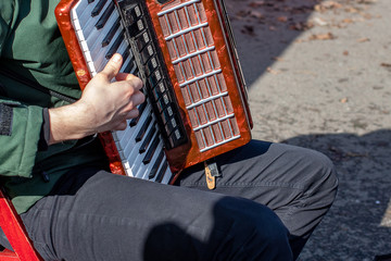 street musician plays the accordion