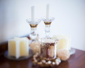 Group of white candles shot with tilt shift lense