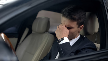 Businessman with eyesight problems feeling unwell, stressful job, busy lifestyle