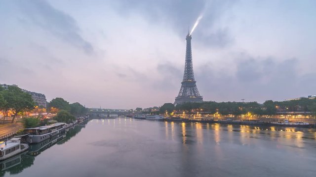 Paris France time lapse 4K, city skyline timelapse at Seine River and Eiffel Tower and Seine River