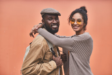 Beautiful smiling woman embracing her beloved boyfriend