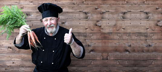 Chef old in uniform with vegetables