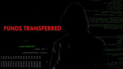 Hacker receiving funds transferred message on screen, bank security attack
