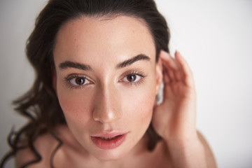 Fototapeta premium Close up portrait curious pretty brunette woman