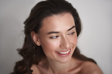 Close up portrait smiling pretty brunette woman