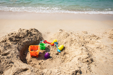 kids toys on tropical sand beach.