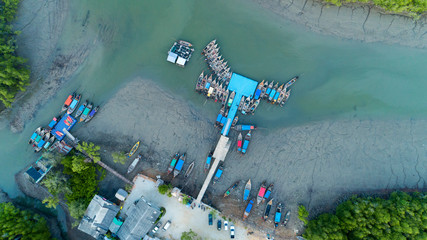 Aerial view top down of Longtail fishing boats in rainforest located at Phang Nga province Thailand