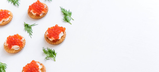 Basis for a banner with sandwiches with red caviar. Salmon caviar for print design, web site, banner, flyer. Appetizer with red caviar